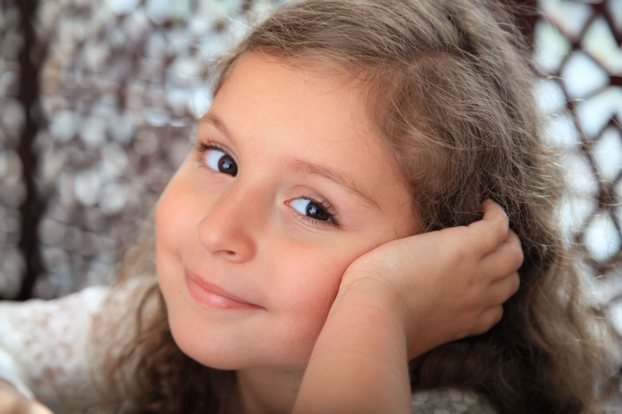 Photographer capturing a portrait session in a sunlit Dubai studio